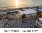 Hurricane Milton storm surge severe damage to waterfront house in Manasota Key, Florida. Destroyed home on gulf coast.