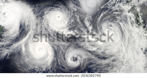 Hurricane season. Collage of a riot of hurricanes\
due to catastrophic climate change. Satellite view. Elements of\
this image furnished by\
NASA.