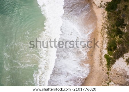 Hurricane Waves eroding a beach in New England