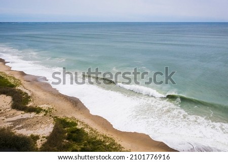 Hurricane Waves eroding a beach in New England