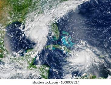 Hurricanes Are Approaching USA,  Tropical Storms Over Sea In Satellite Photo. View Of Typhoons Of Earth From Space. Weather Forecast, Season, Aerial Photography. Elements Of Image Furnished By NASA