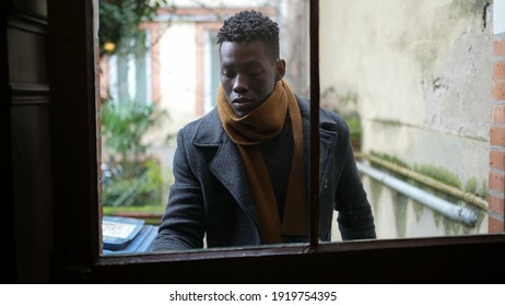 Hurried Young Black Man Leaving Home Opening Front Door