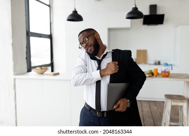 Hurry To Work. Portrait Of Black Business Man In Glasses Talking On Cellphone At Home, Busy African American Male Being Late, Wearing Suit Holding Laptop In Hands, Getting Ready, Rushing To Office