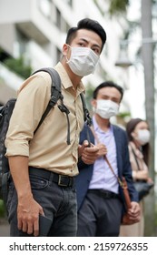 Hurrying Anxious Young Asian Man In Protective Mask Waiting For Taxi Or Bus