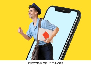 Hurrying postman with letter and big mobile phone on yellow background