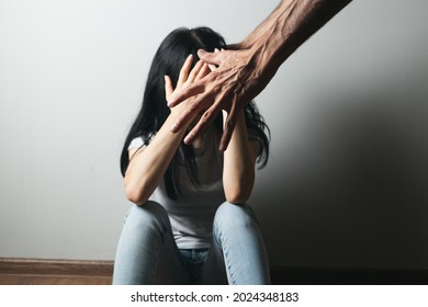 husband beats his wife. domestic violence - Shutterstock ID 2024348183