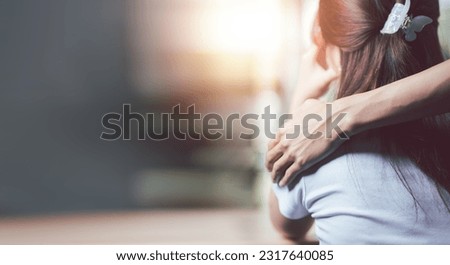 Husband embracing wife's shoulder to support each other ,Relationship care concept ,comforting family members ,mutual encouragement,tenderness ,comfort and sympathy ,helping ,giving hope and believing
