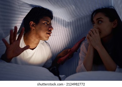 Husband Telling Wife Scary Story For Under Blanket