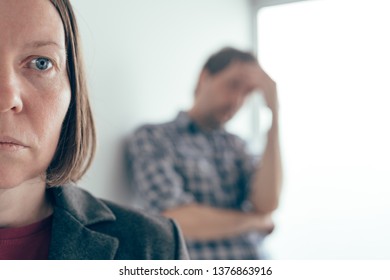 Husband and wife arguing, man yelling at woman in domestic dispute concept - Shutterstock ID 1376863916