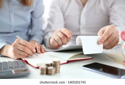 Husband and wife check purchases for deducting tax credits. Online tax form concept. - Shutterstock ID 1405201745