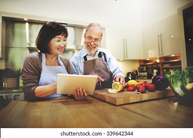 Husband Wife Cooking Searching Menu Tablet Concept - Powered by Shutterstock