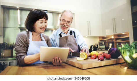 Husband Wife Cooking Searching Menu Tablet Concept