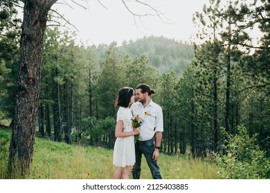 Husband And Wife Embrace In The Black Hills National Forest