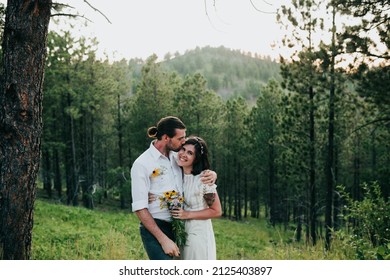 Husband And Wife Embrace In The Black Hills National Forest