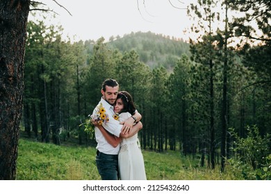 Husband And Wife Embrace In The Black Hills National Forest