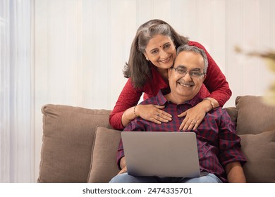 A HUSBAND AND WIFE HAPPILY LOOKING AT CAMERA AND POSING
 - Powered by Shutterstock