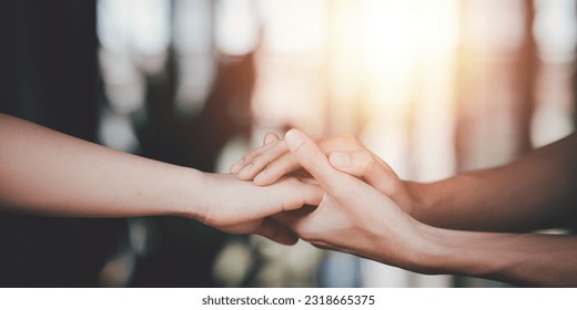 Husband and wife join hands to cheer ,Relationship care concept ,comforting family members ,mutual encouragement ,tenderness ,comfort and sympathy ,helping ,giving hope and believing - Shutterstock ID 2318665375
