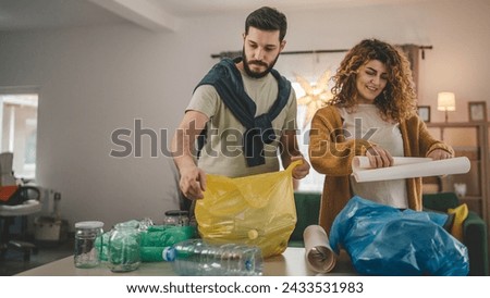 husband and wife woman and man family recycle at home sorting waste plastic paper and glass to green, yellow and blue bags sustainable living concept