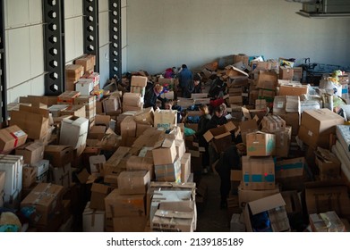 Hust  Ukraine - March 22 2022: Volunteer Work At The Humanitarian Aid Warehouse. Documentary Photography Of Military Rear Town Life During War Russian Invasion In Ukraine