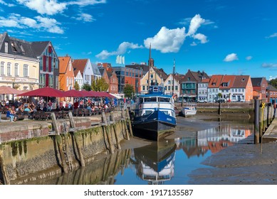 Husum, Germany - September 16, 2019: Historic cityscape at the inland port of Husum in North Friesland in Germany