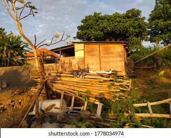 A Hut With Bamboo And Woody Debris Scattered In The Field