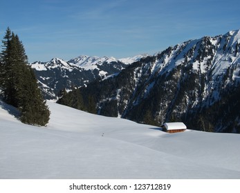 Hut In A Snow Landscape