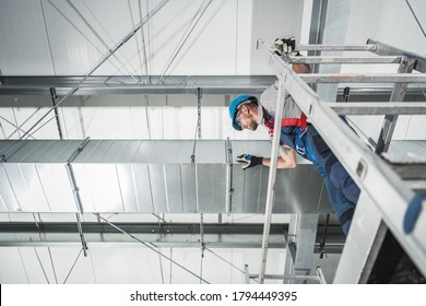 HVAC Air Quality Technologies Technician Finishing Project. Looking From Scaffolding On The Air Shaft. Heating And Cooling.