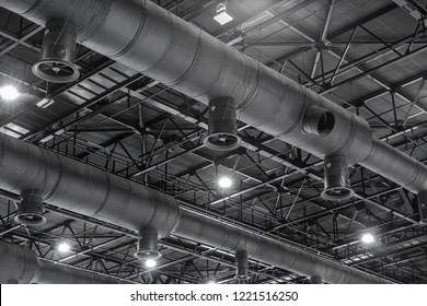 HVAC Duct Cleaning  Ventilation pipes in silver insulation material hanging from the ceiling inside new building 