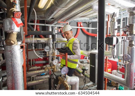 HVAC engineer in boiler room