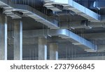 HVAC engineering, Building ventilation. Network of metal air ducts suspended under ceiling for air distribution in commercial or industrial facility