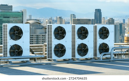 HVAC engineering, rooftop cooling systems operate to regulate building climate and improve energy efficiency across an urban commercial district.