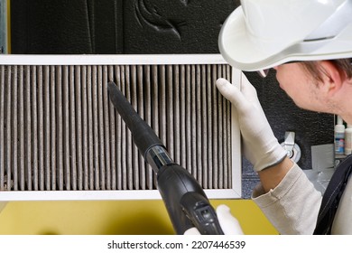 Hvac Filter Replacing. Replacing The Filter In The Central Ventilation System, Furnace. Replacing Dirty Air Filter For Home Central Air Conditioning System. Change Filter In Rotary Heat Exchanger