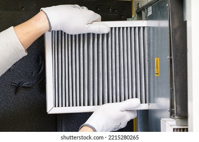 hvac filter replacing. Replacing the filter in the central ventilation system, furnace. Replacing Dirty Air filter for home central air conditioning system. Change filter in rotary heat exchanger - Shutterstock ID 2215280265