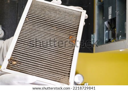 hvac filter replacing. Replacing the filter in the central ventilation system, furnace. Replacing Dirty Air filter for home central air conditioning system. Change filter in rotary heat exchanger