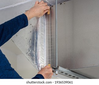 HVAC Service Technician Changing Dirty Indoor Air Filter In Residential Heating And Air Conditioning System. Home Air Duct Ventilation System Maintenance For Clean Air.