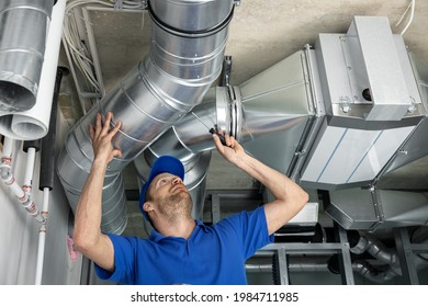 hvac services - worker install ducted pipe system for ventilation and air conditioning in house