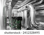 HVAC system pipes and pumps, handling heating, ventilation, air conditioning, and cooling, tubes are located on the ceiling. Climate control system ensures the comfort of the rooms in the building.