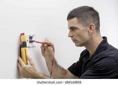 HVAC Tech Checking Low Voltage On A Thermostat