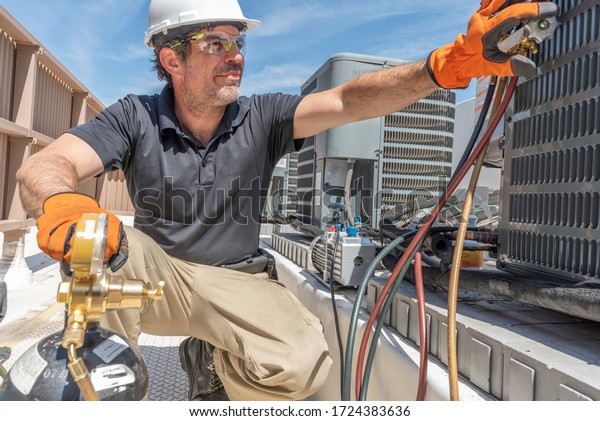 Hvac Tech Working On Installing New Stock Photo (Edit Now) 1724383636