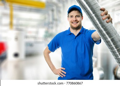 Hvac Technician With Flexible Aluminum Ducting Tube In Hand