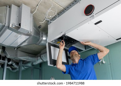 hvac technician install ducted heat recovery ventilation system with recuperation