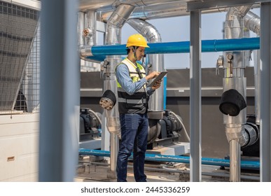 HVAC technician use tablet to record data and conduct real-time analysis. Using specialized software to diagnose and optimize mechanical, electrical, and plumbing systems with energy efficiency plan - Powered by Shutterstock