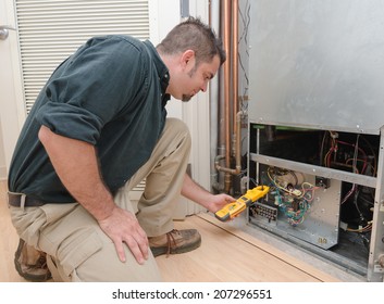 HVAC Technician Using A Meter To Check Heat Pump Amperage