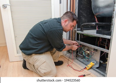 HVAC Technician Working On A Residential Heat Pump