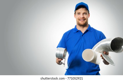 Hvac Worker With Ventilation System Equipment In Hands On Gray Background