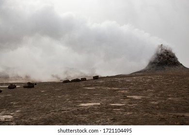 HVERIR, ICELAND - SEPTEMBER 22, 2018: Hot Steam Vents At The Hverir Geothermal Area Near Lake Myvatn In Northern Iceland. Grey And Overcast Day. Sulfur Smell. Otherworldly Landscape.