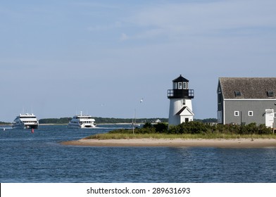 Hyannis Harbor Lighthouse Guides Ferry Boats Out Of The Harbor In Cape Cod, In Massachusetts, During The Summer Tourist Season.