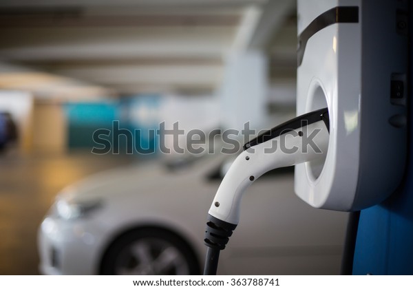 Hybrid car\
electric charger station in the Car\
Park.