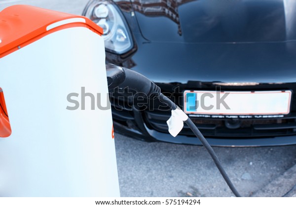 Hybrid car\
electric charger station in the Car\
Park.