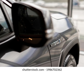 Hybrid Car Logo On The Back Side Of Automobile